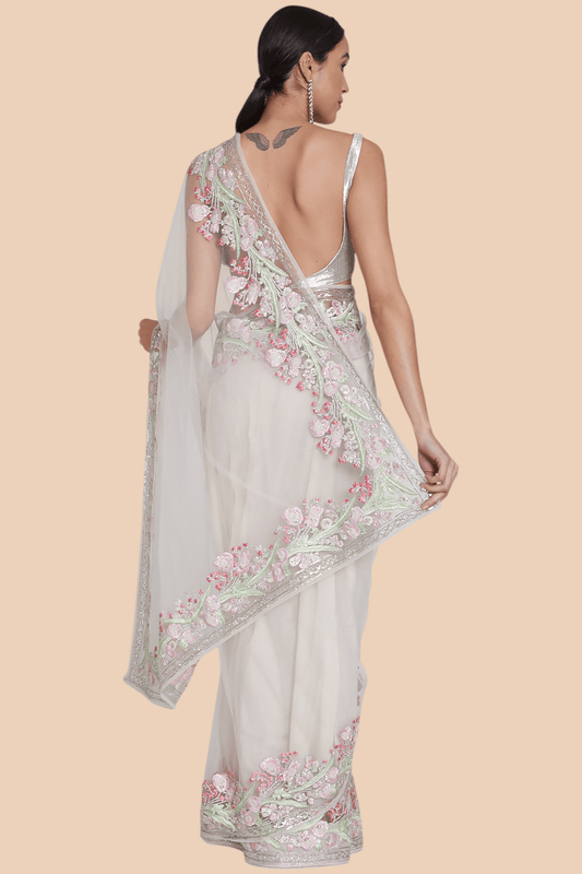Back view showing full drape and embroidery of baby pink net sari