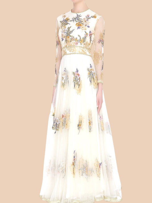 Ivory gown featuring floral embroidery and sheer sleeves, adorned with gold lace appliqué for a timeless elegance.