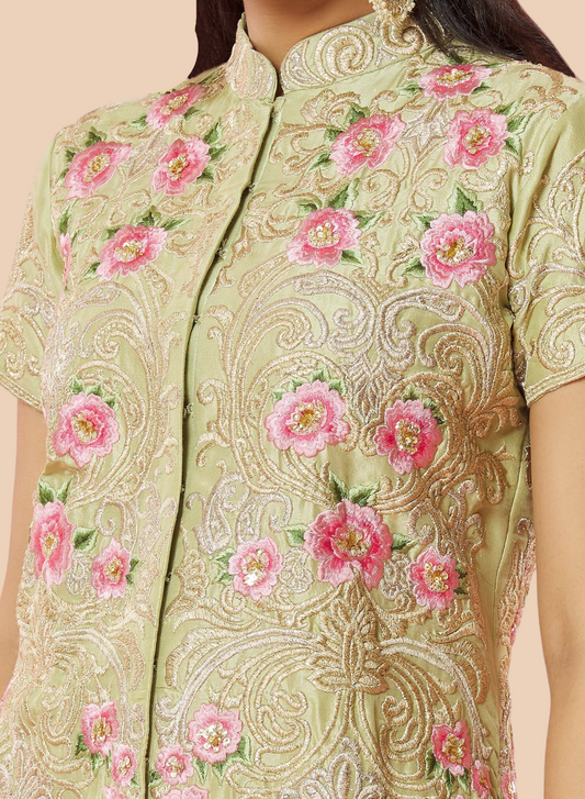 Stunning pink embroidered lehenga suit with a floral silk top, paired with a matching dupatta and georgette sharara.