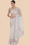 Front view of baby pink net sari with floral embroidery and sequin border