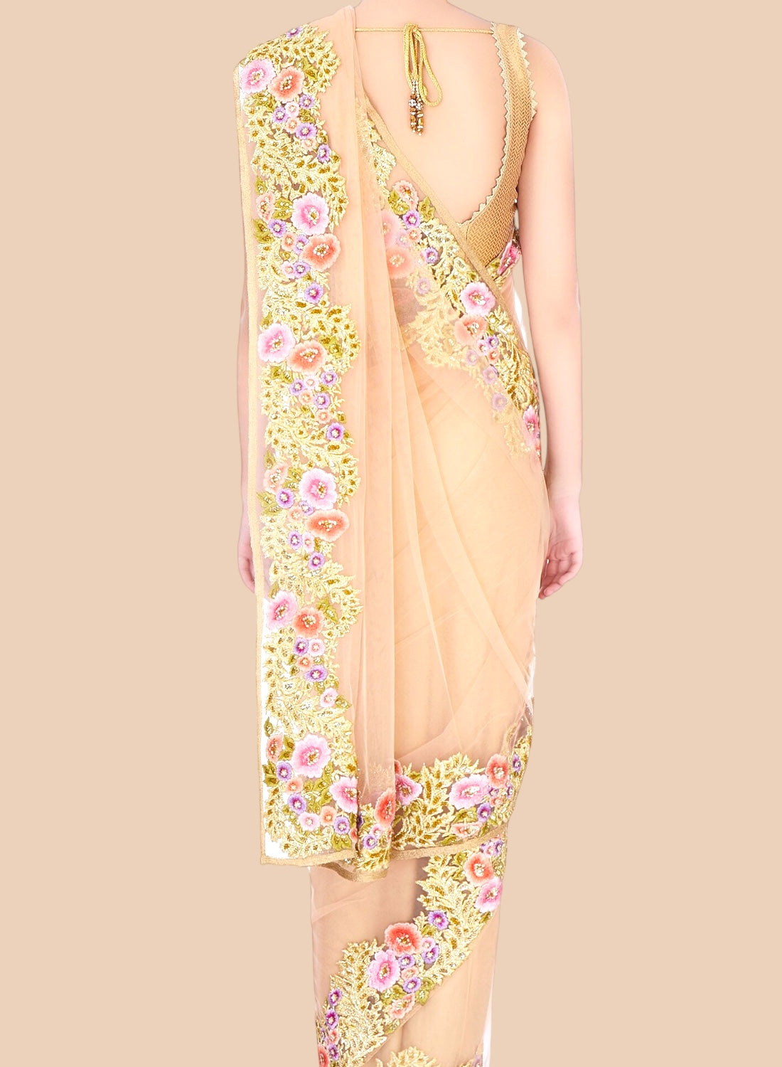 Beige saree with floral embroidery on a beige background
