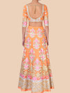 Orange floral dress with a matching top on a beige background