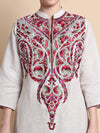 Embroidered kurta with intricate patterns on a beige background