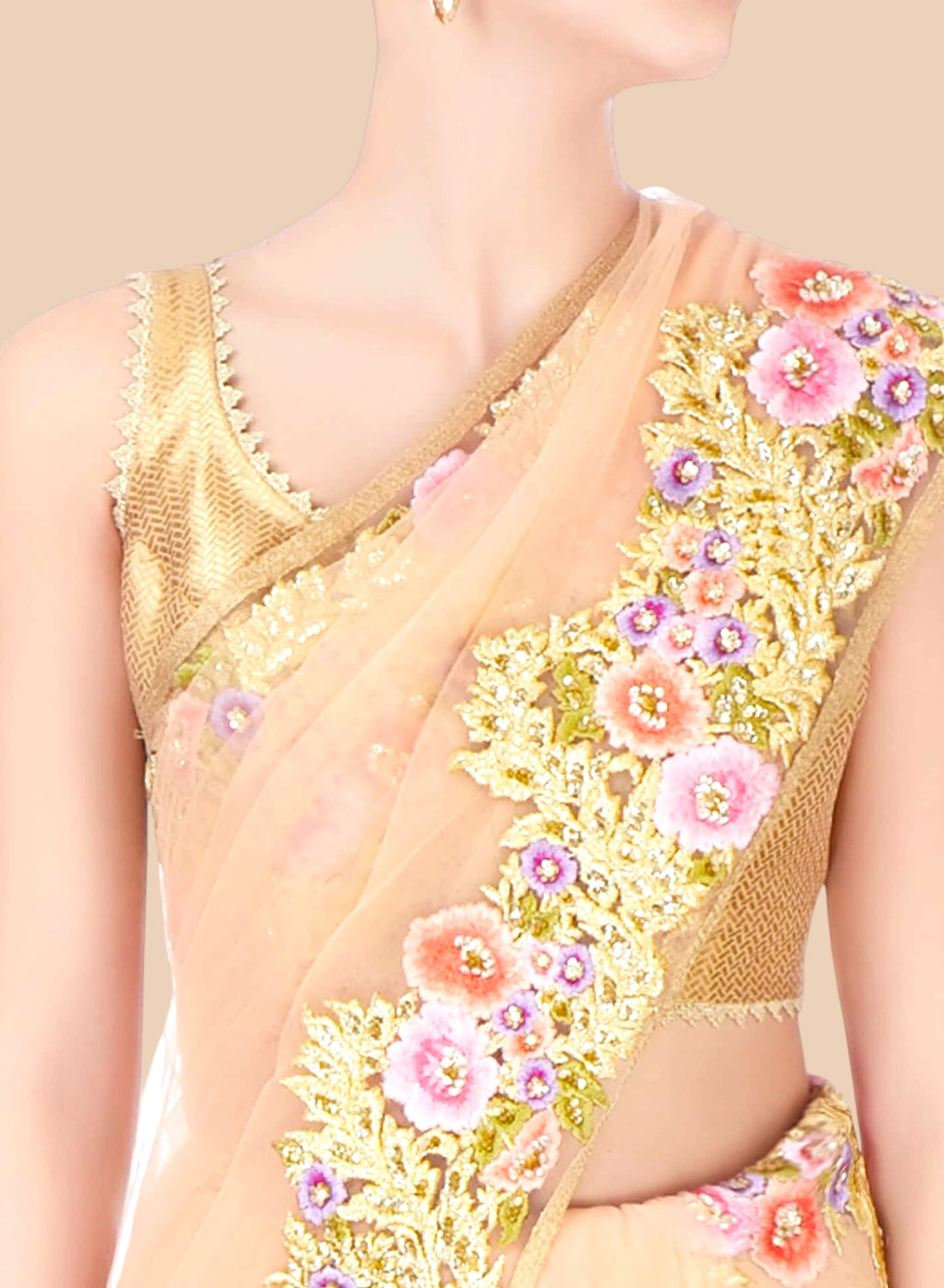 Close-up of a saree with floral embroidery on a neutral background