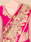 Pink saree with gold embroidery on a plain background