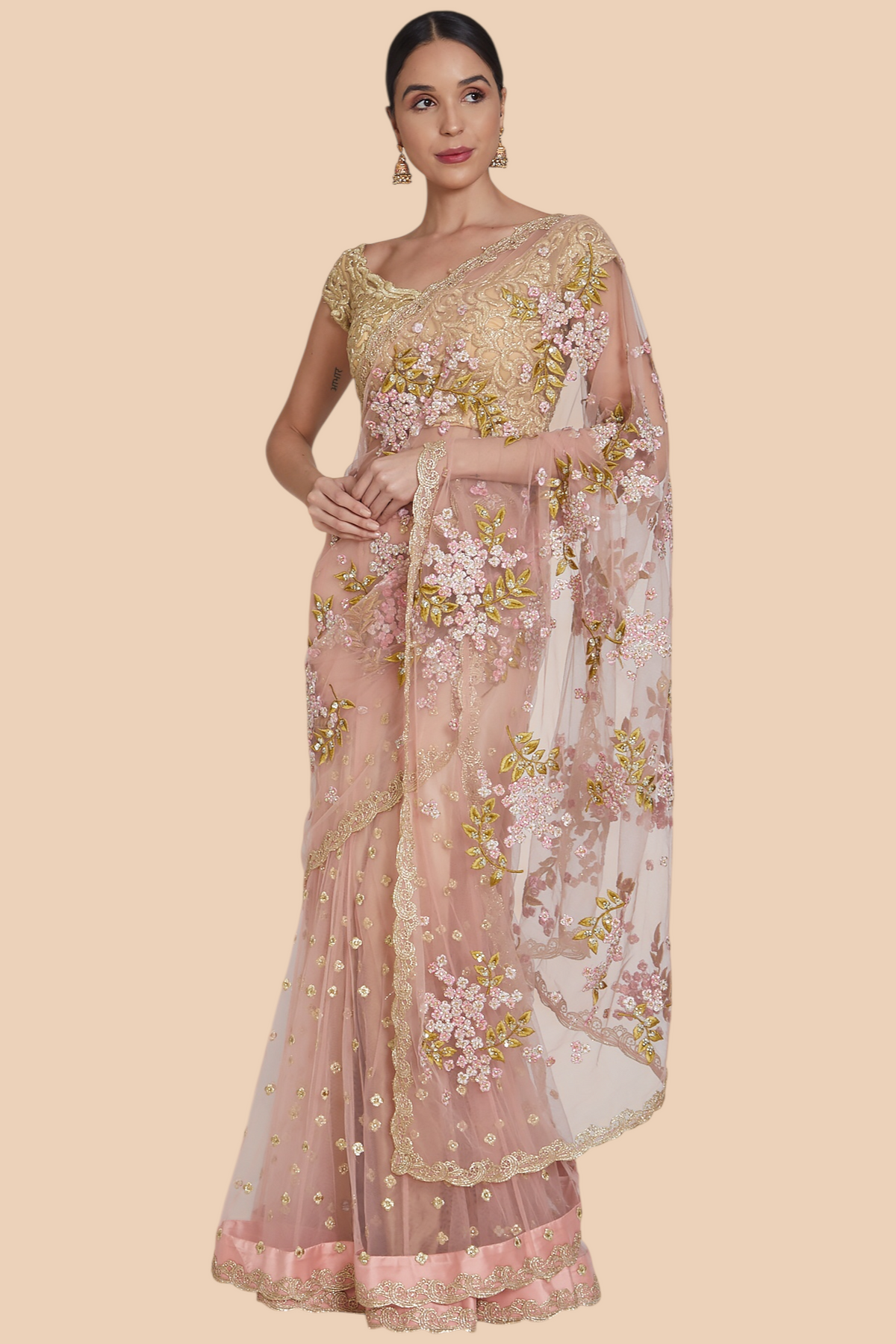 Front view of dull rose net lehenga sari with floral and sequin embroidery