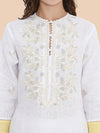 Close-up of ivory resham and zari embroidery on white linen neckline and sleeves