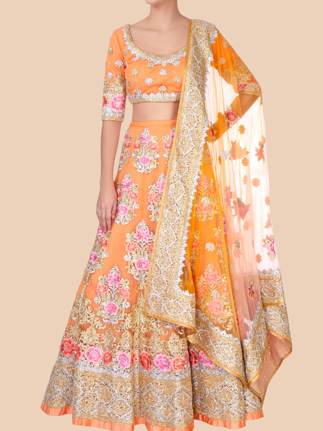 Orange and pink traditional outfit with floral patterns on a beige background