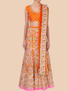 Orange and floral patterned traditional outfit on a beige background