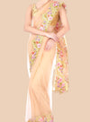 Beige saree with floral embroidery on a beige background