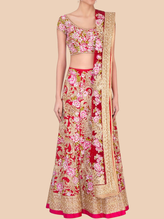Traditional Indian outfit with floral patterns on a beige background
