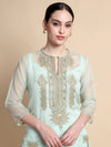 Light blue embroidered kurta worn by a model on a beige background