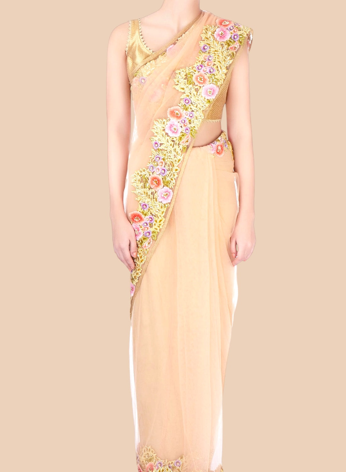 Beige saree with floral embroidery on a beige background