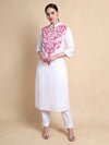 White kurta with pink embroidery on a beige background