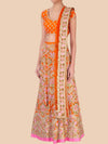 Orange and floral patterned traditional outfit on a beige background