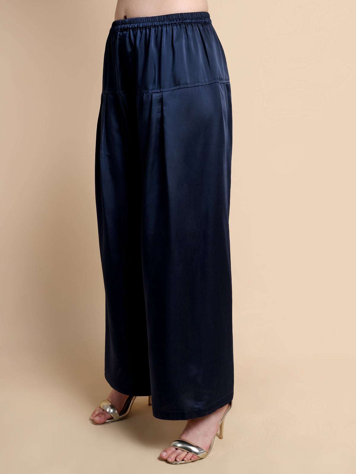 Navy blue wide-leg pants on a beige background