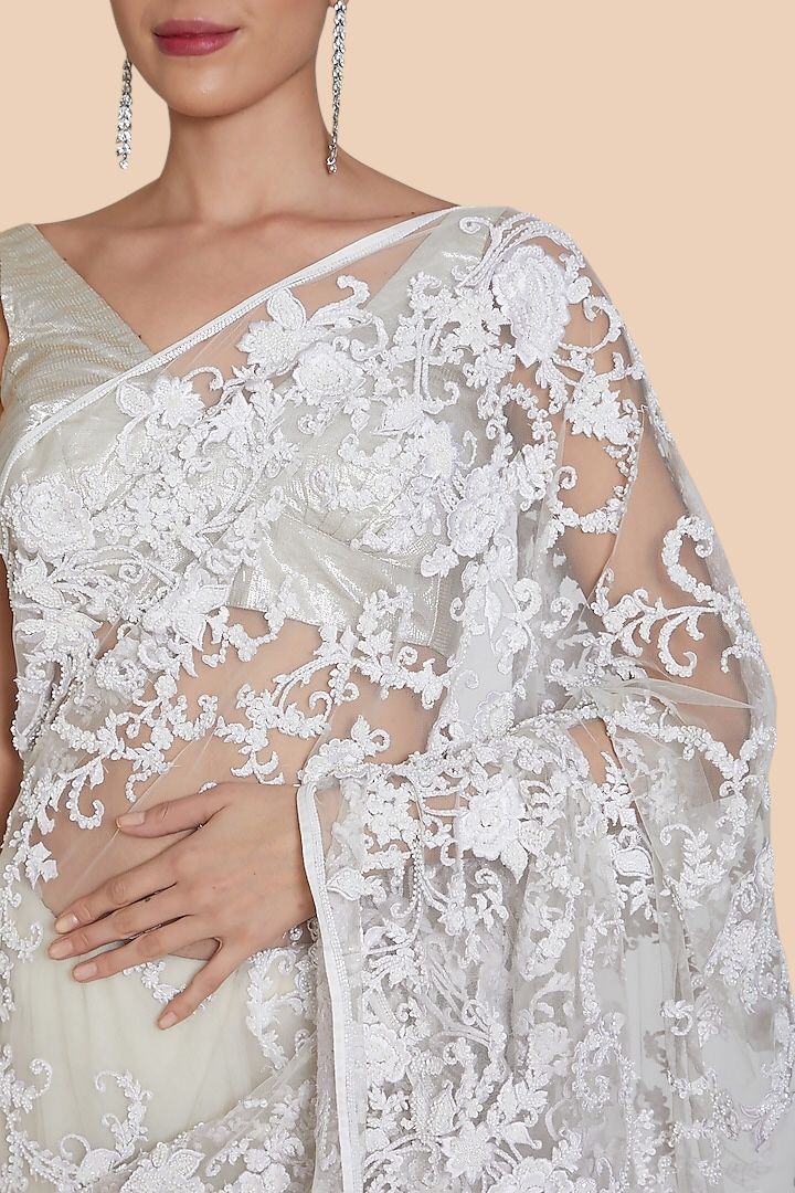 Close-up view of embroidered pallu with sequins, resham, and beads