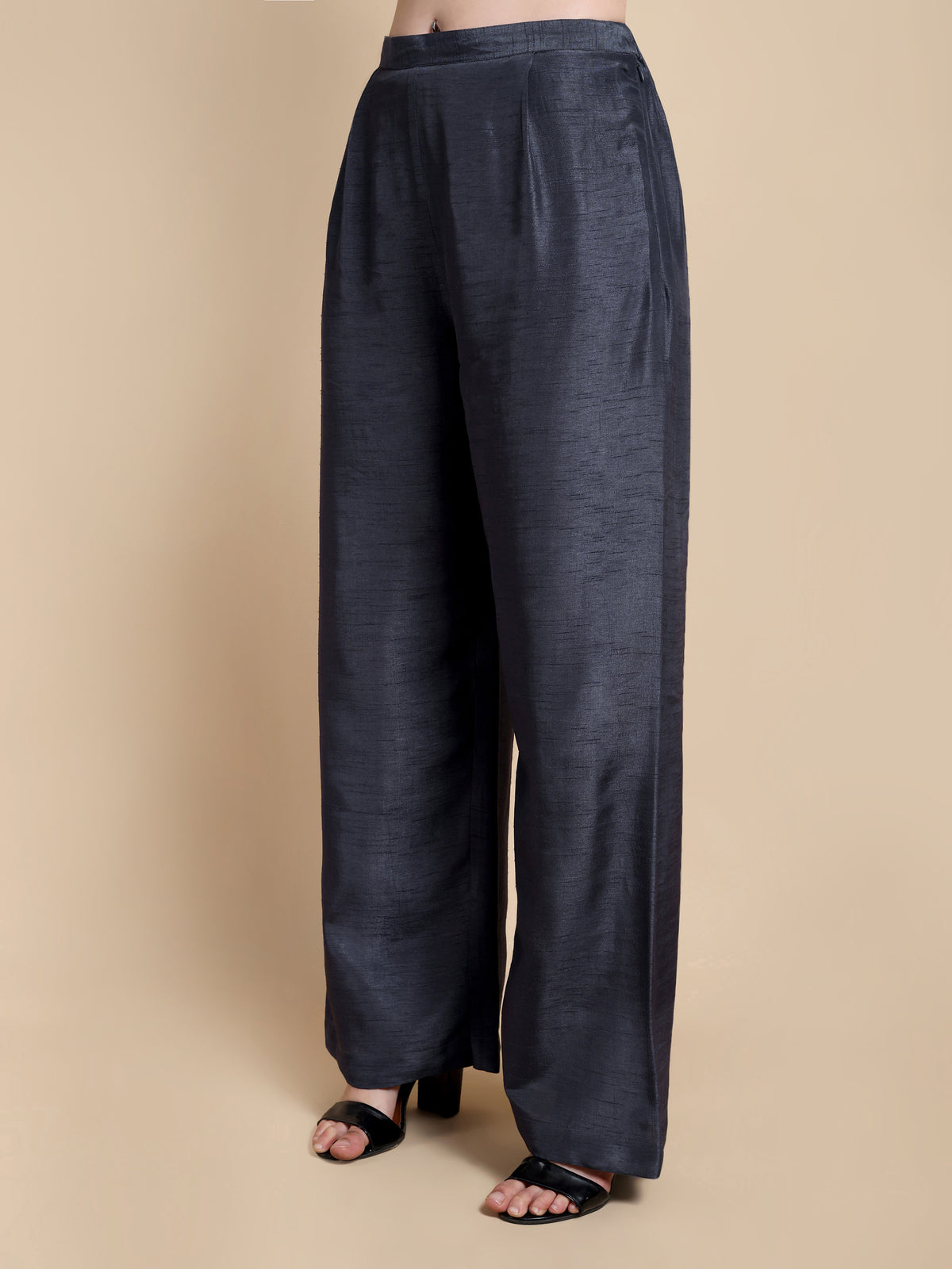 Dark blue wide-leg pants on a beige background