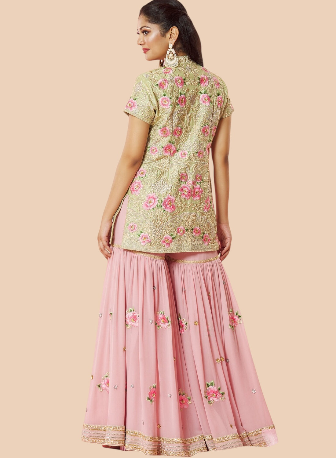  Stunning pink embroidered lehenga suit with a floral silk top, paired with a matching dupatta and georgette sharara.