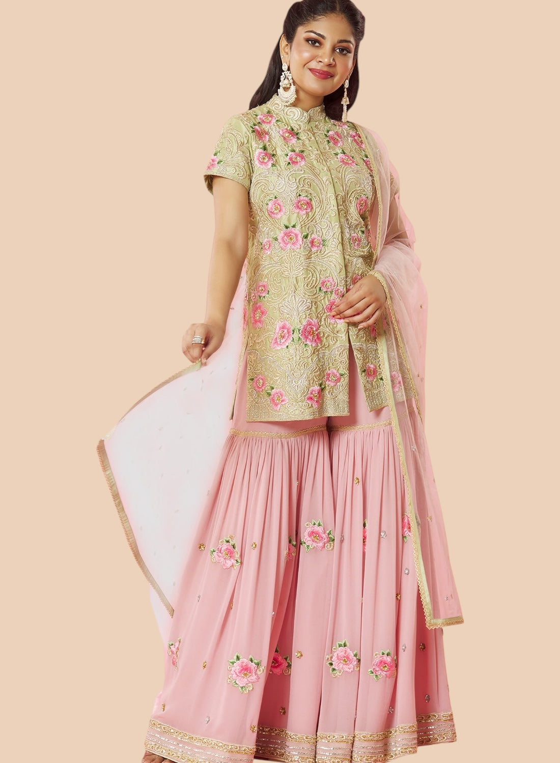  Stunning pink embroidered lehenga suit with a floral silk top, paired with a matching dupatta and georgette sharara.