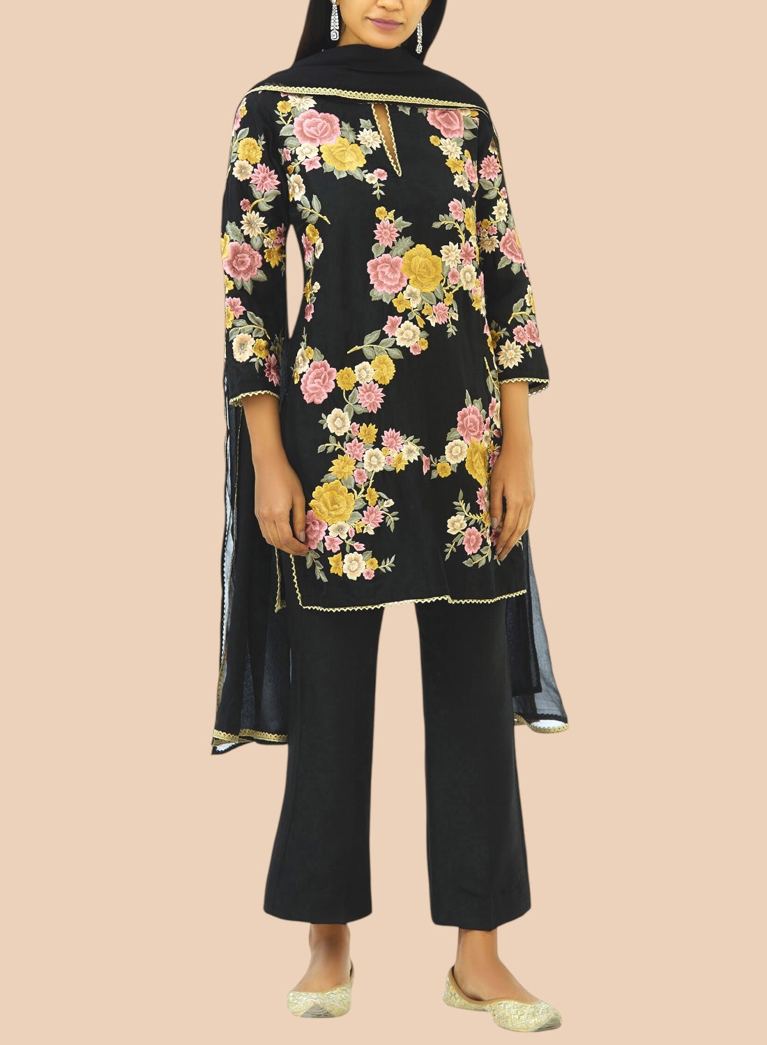 Black pure silk suit featuring floral embroidery, paired with narrow trousers and a delicate net dupatta for a refined look.