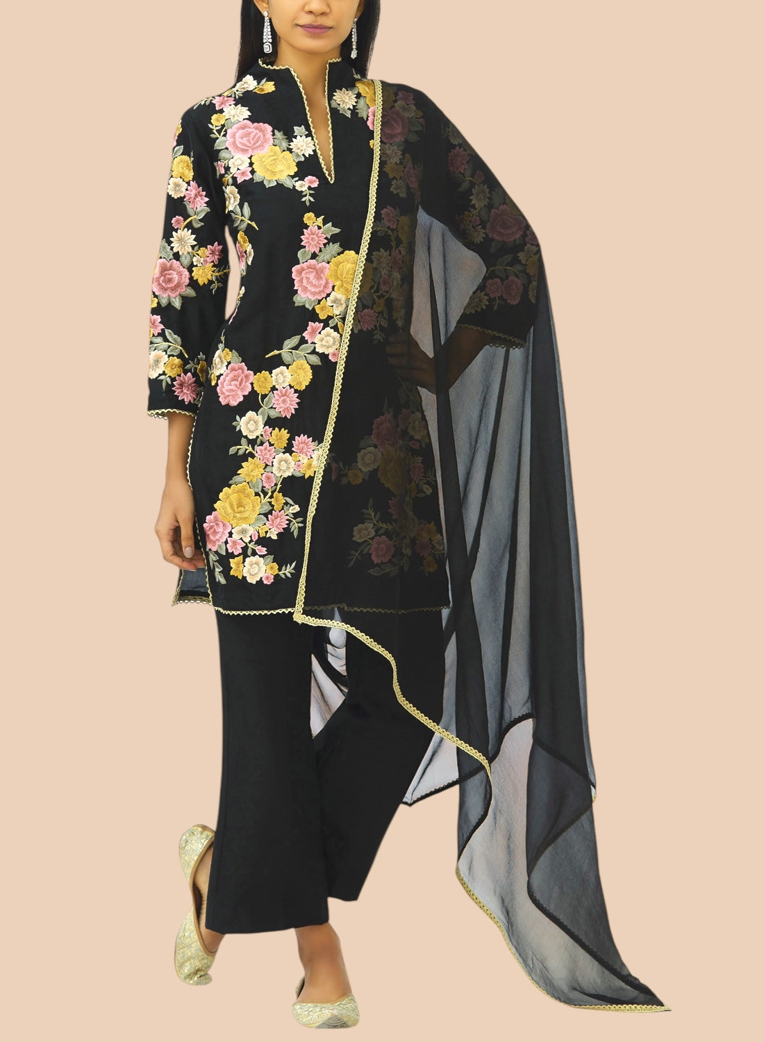 Black pure silk suit featuring floral embroidery, paired with narrow trousers and a delicate net dupatta for a refined look.