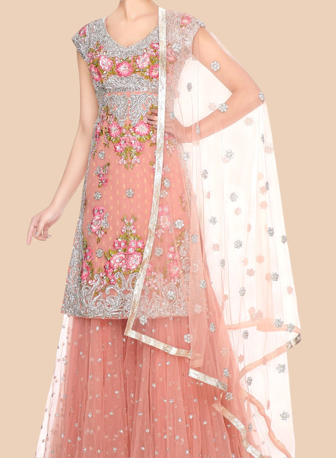 Beautiful rose net Sharara set adorned with floral embroidery and silver scrolls, paired with a delicate dupatta for elegance.