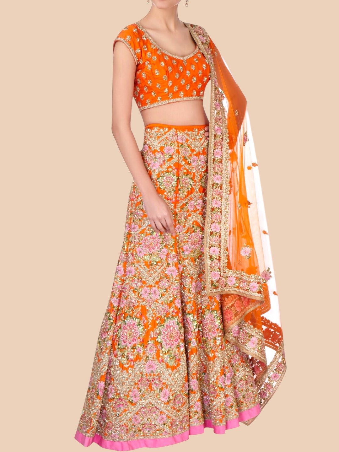 Orange and floral patterned traditional outfit on a beige background