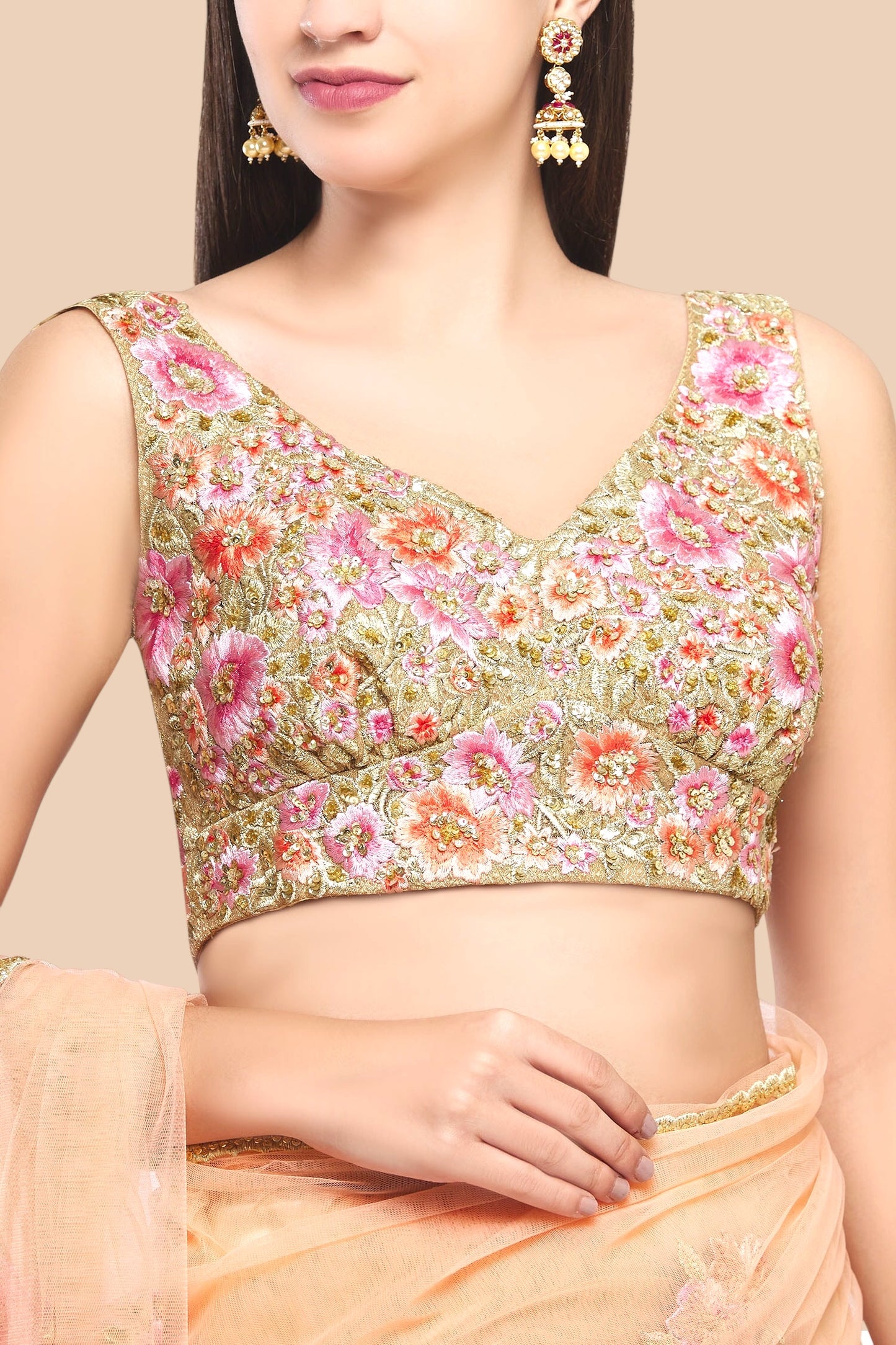 Woman wearing a floral blouse with a beige background