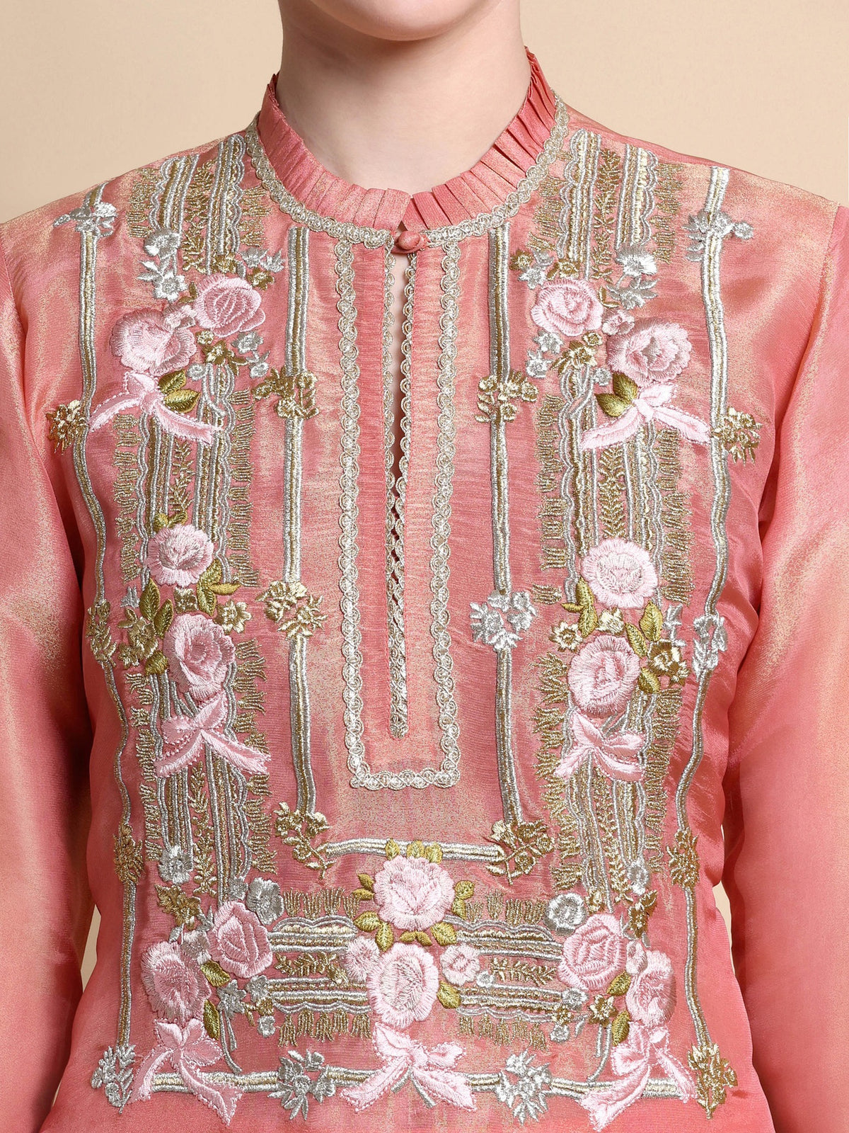 Close-up of floral Resham and zari embroidery on neckline of pink tissue kurta