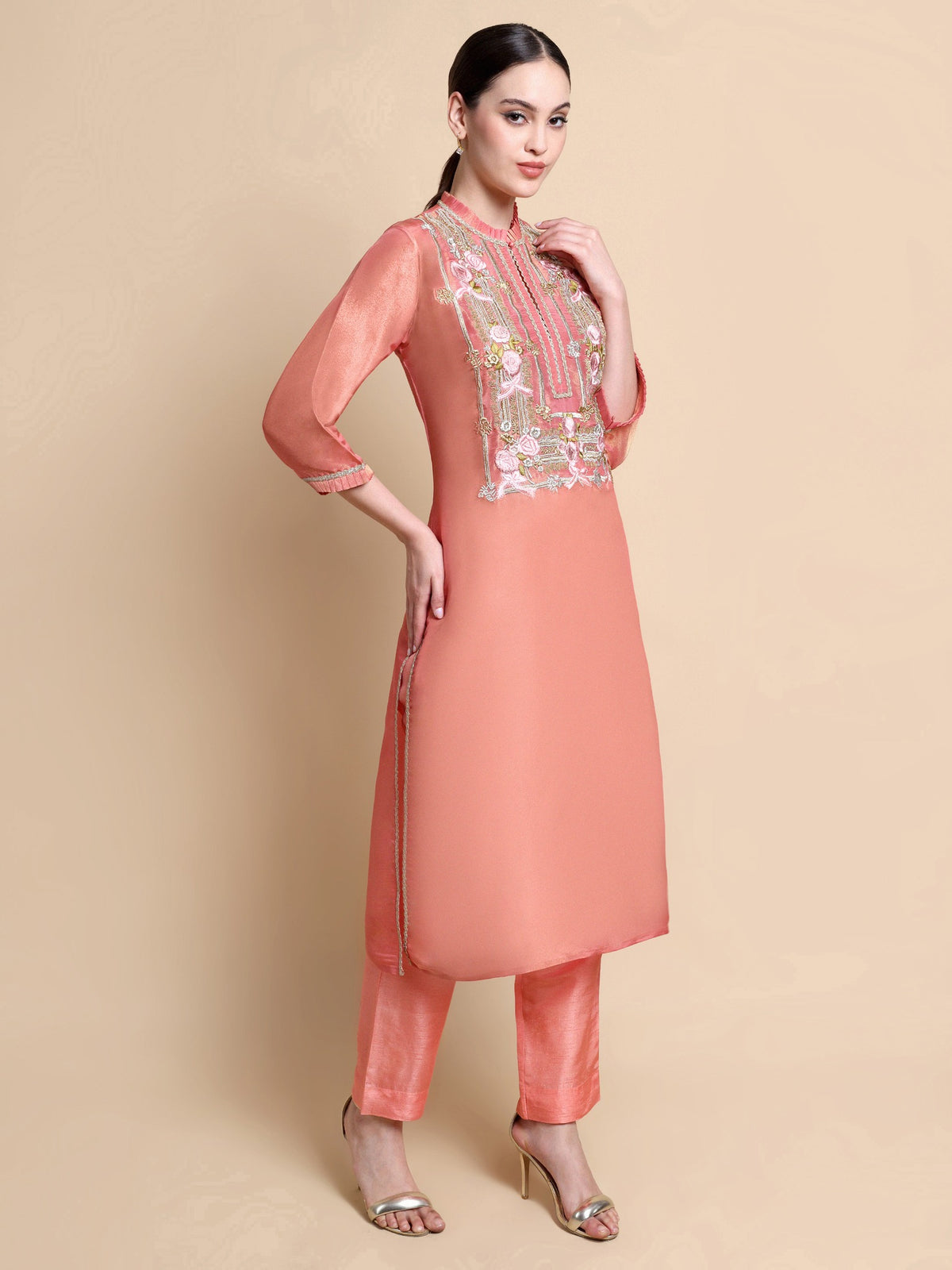 Side view of embroidered pink tissue kurta showing elegant straight silhouette
