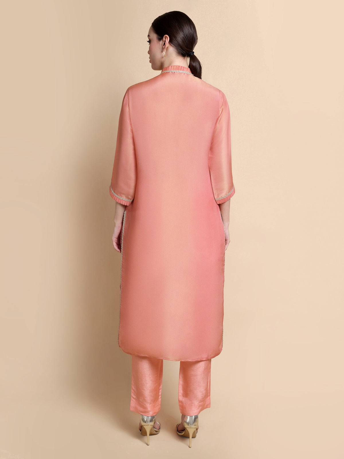 Back view of pink tissue silk kurta paired with straight-fit Dupion trousers