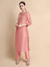 Side angle showing silhouette and embroidery of pink tissue kurta