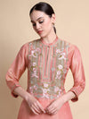 Front view of pink tissue silk kurta with floral embroidery at the neckline and Dupion trousers